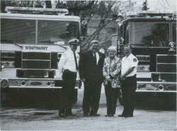 Group photo in front of the new fire trucks