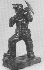 Courtesy of the University Museum. Southern Illinois University at Carbondale - Coal Miner, wood sculpture, by Fred Myers 