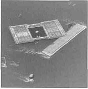 A barge up against a submerged building