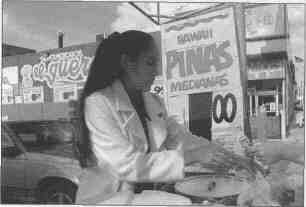 A woman sells tamales and hot chocolate outside a Mexican
grocery in Chicago