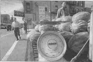 Baldo Violettas sells watermelons from the back of his pickup truck, which is parked in the heart of Chicago's Chinatown