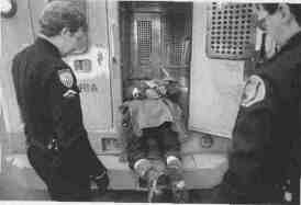 Answering a disturbance call in front of a local hotel,  
police officers groan as they realize one of them will have to lift  
Willie the rest of the way into the paddy wagon because he is loo  
drunk to climb in. Police officers say they do not see any humor in  
Willie's antics