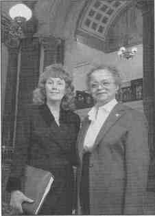 Lobbyists Lynne Padovan and Billie Paige at the 
rail in the state Capitol rotunda