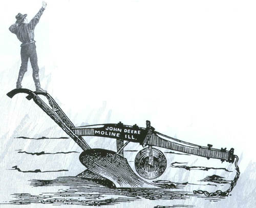 Man standing on a plow